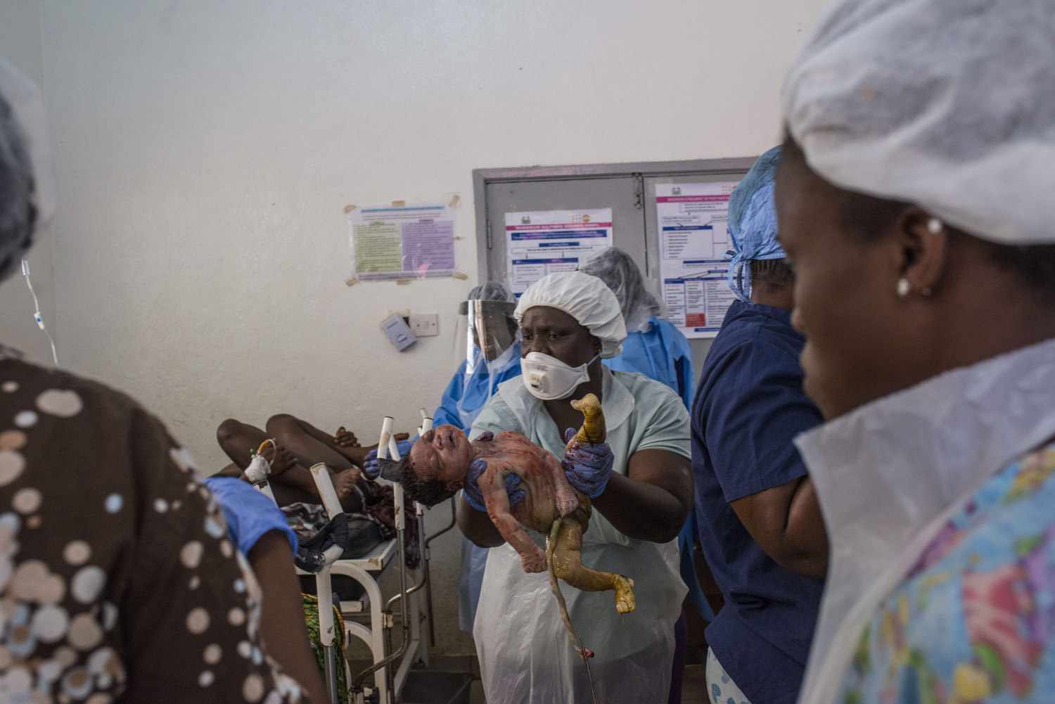  Christiana Dasama,17 delivers a baby at Kenema Government Hospital in Kenema, Sierra Leone on November 11th, 2015. 