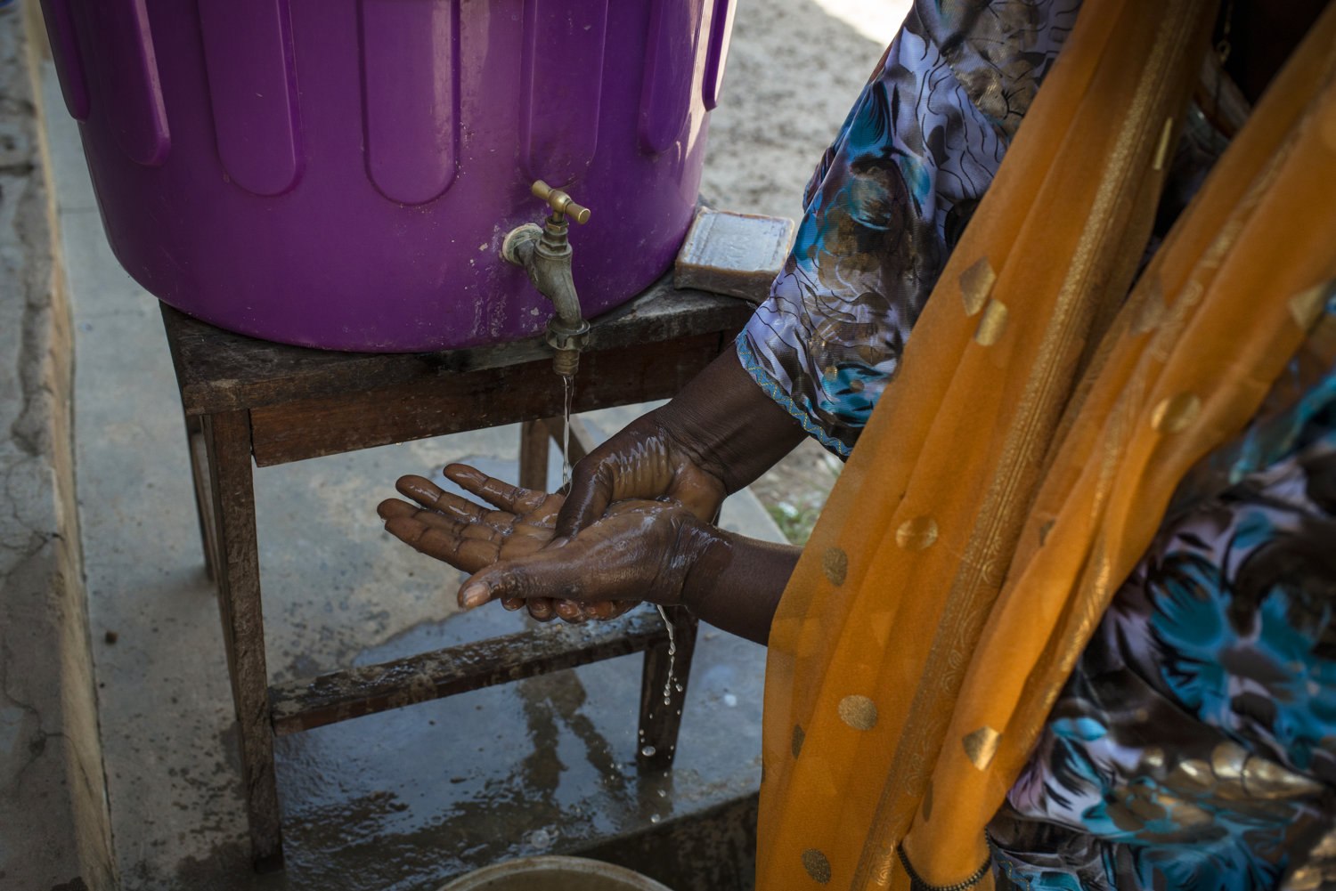  At a rural clinic patients as well as visitors must wash their hands in chlorinated water before entering the health post- the most rural of health clinics available in Guinea. This post is in Heriko, a village outside of Faranah, Guinea on November