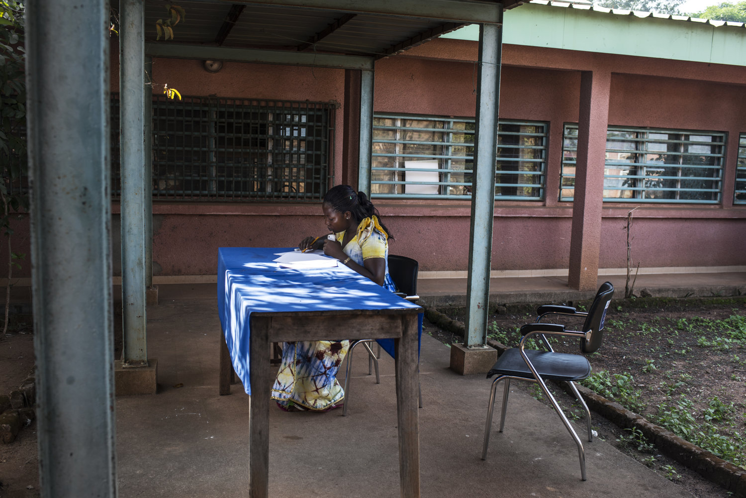  Haba Madeline takes a final test before class begins on Day 5of the JHIPAGO training is led by Dr. Thierno Sadou- where he shows how Ebola is transmitted through contact in Faranah, Guinea on November 21th, 2015.  