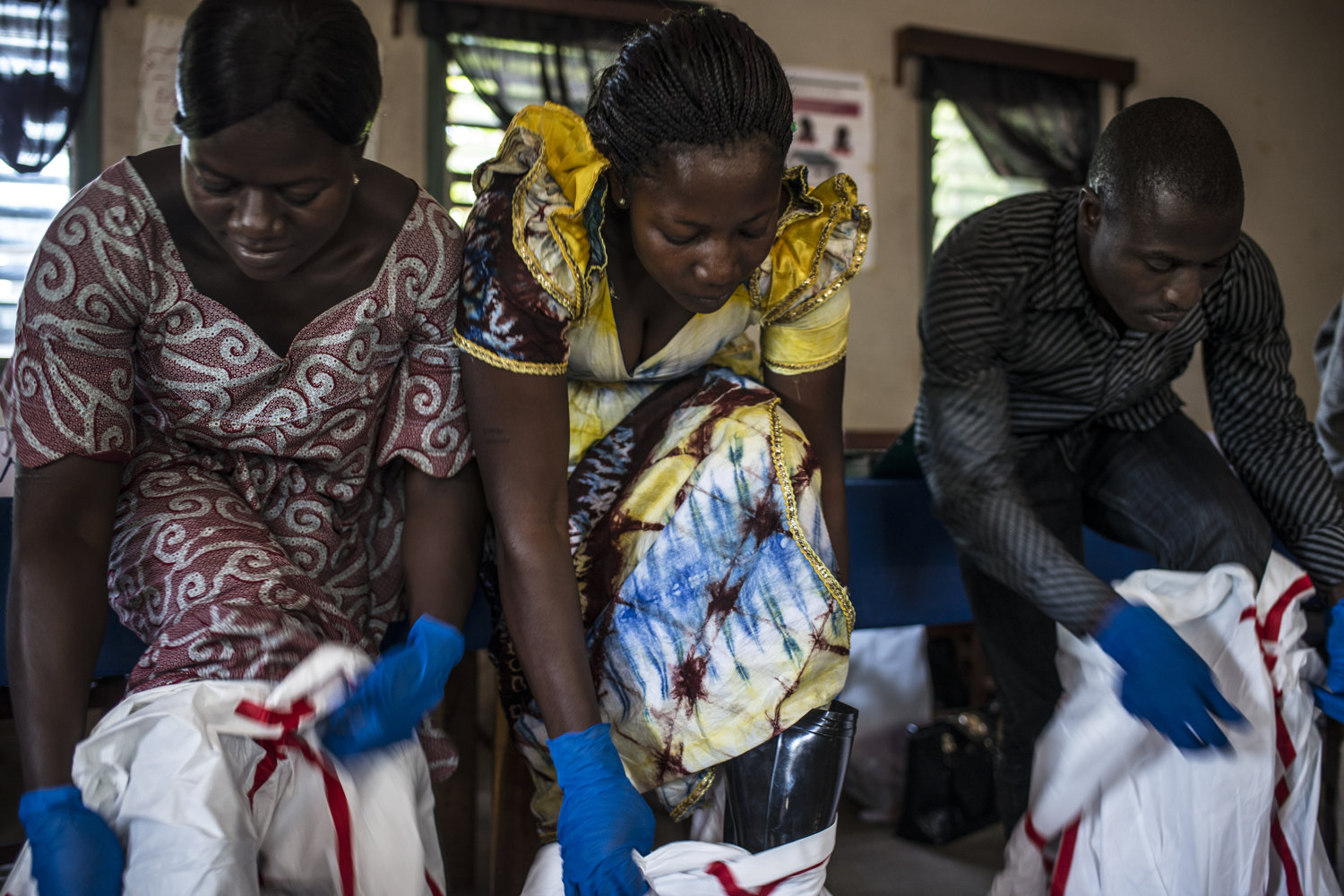  Students Elisabeth Haba, Madeline Haba and Ismael Camera complete the final tests of the training, including putting on protective gear.
 