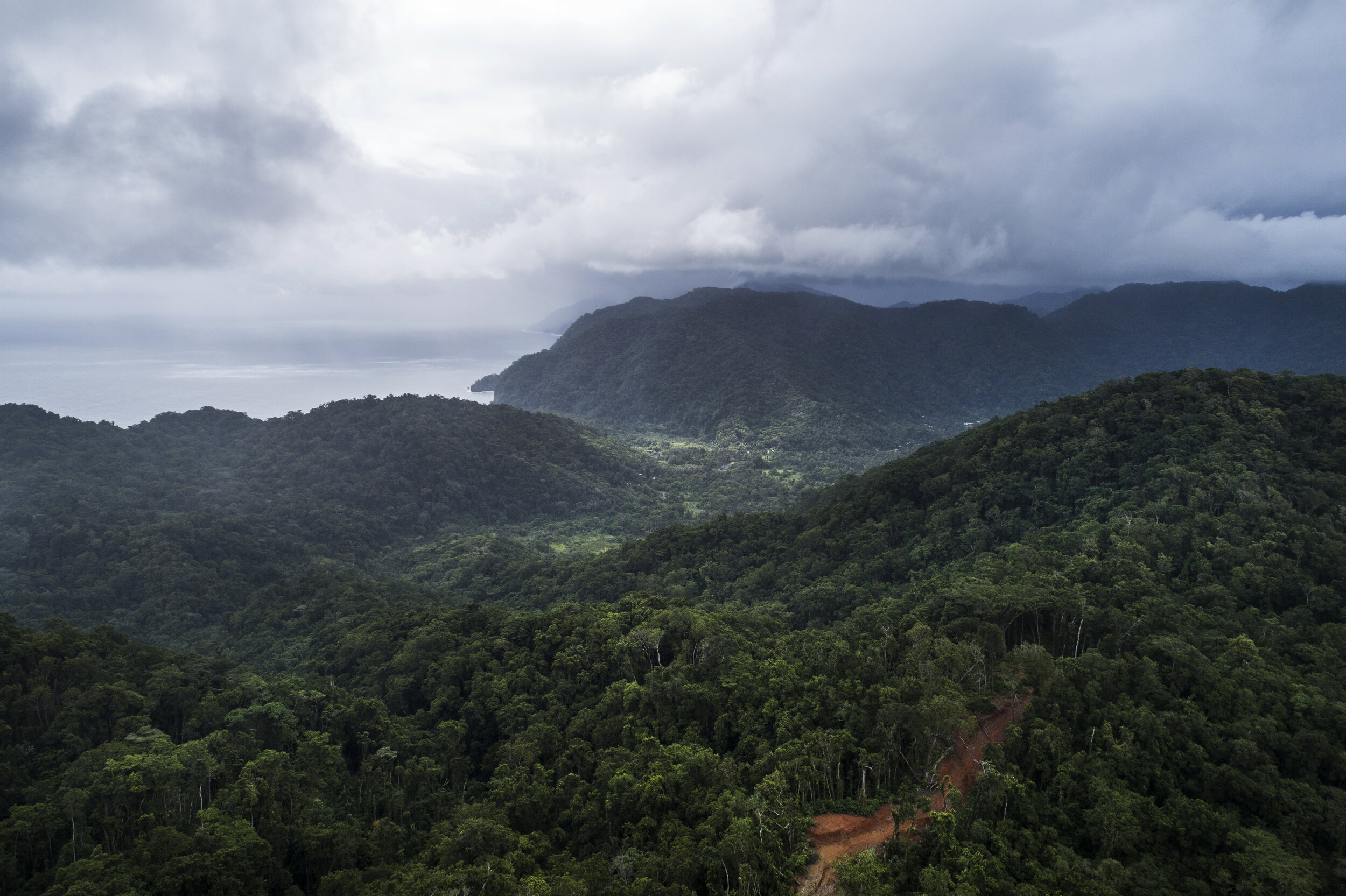  The village of Marasa and surrounding valley can be seen from the former logging camp. A logging road leads up to the main camp of the Galego company before they were ejected by a group of locals who ejected the company through legal means. Logging 