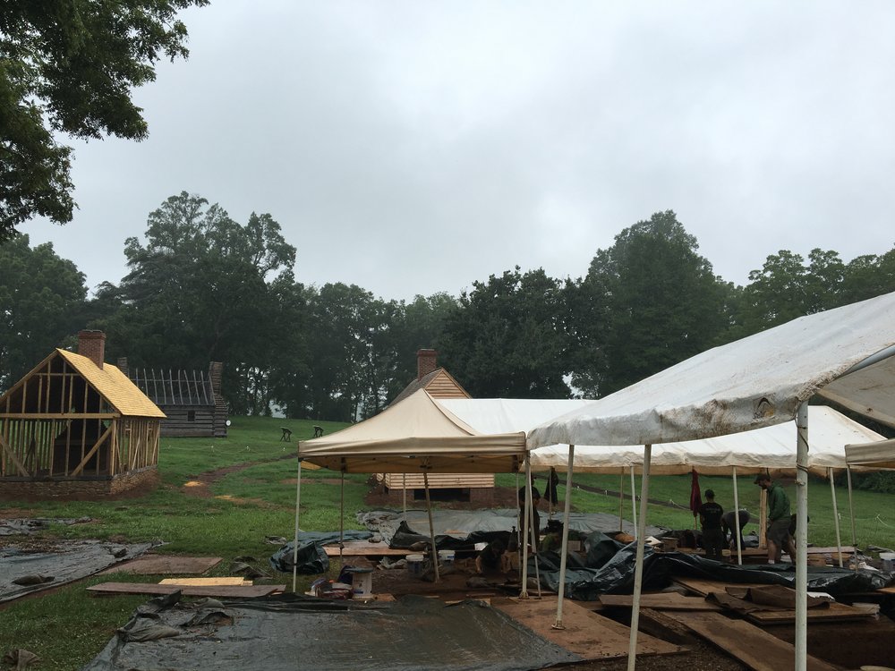  View of the South Yard, where two structures have been "ghosted" (not fully reconstructed), another has been rebuilt, and the team is hard at work in the location of another structure (the South Kitchen) 