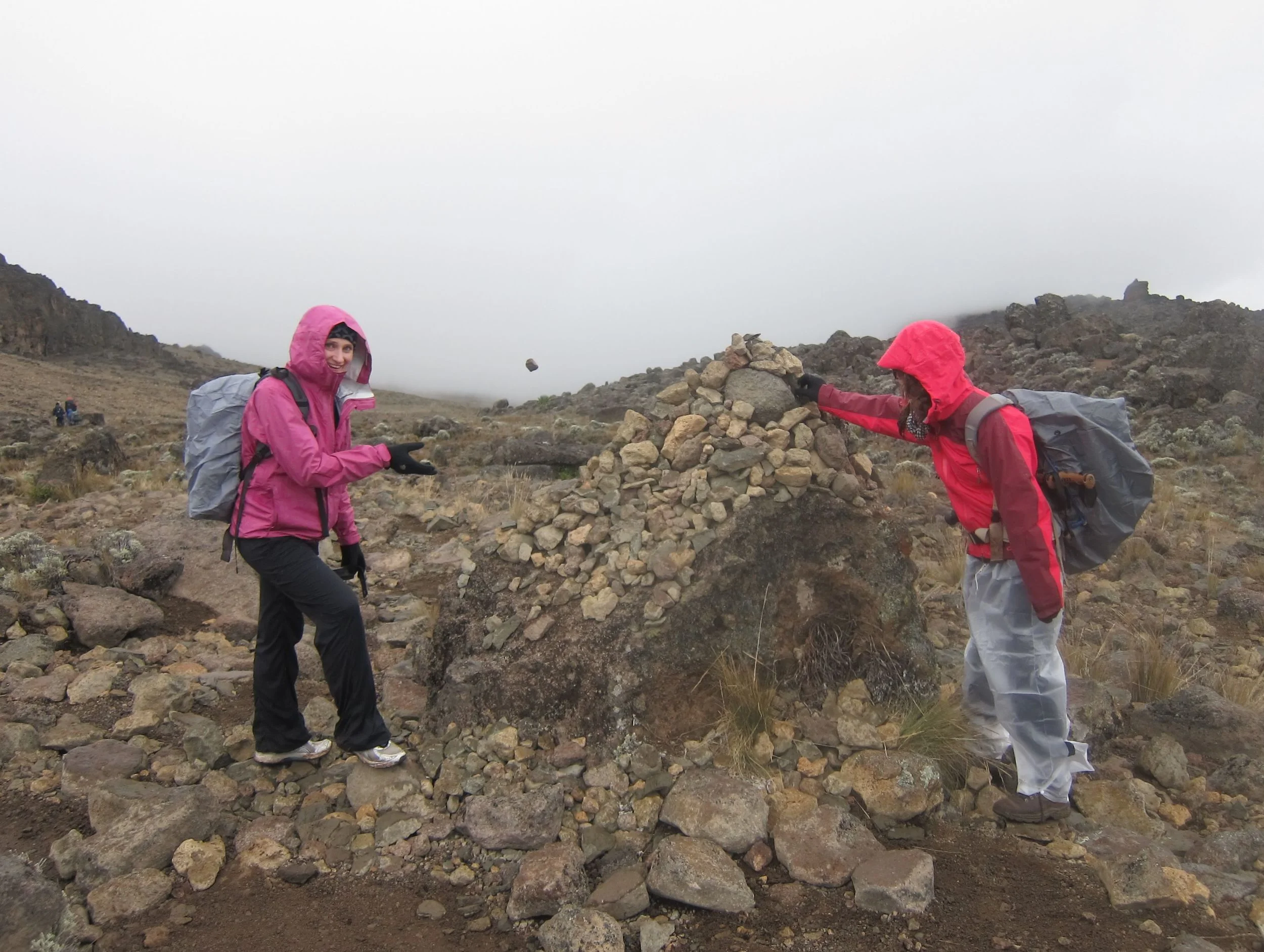 Adding a rock to the trail marker aka Cairns. Note: Olga's rock in mid-air and my sandwich bag pants