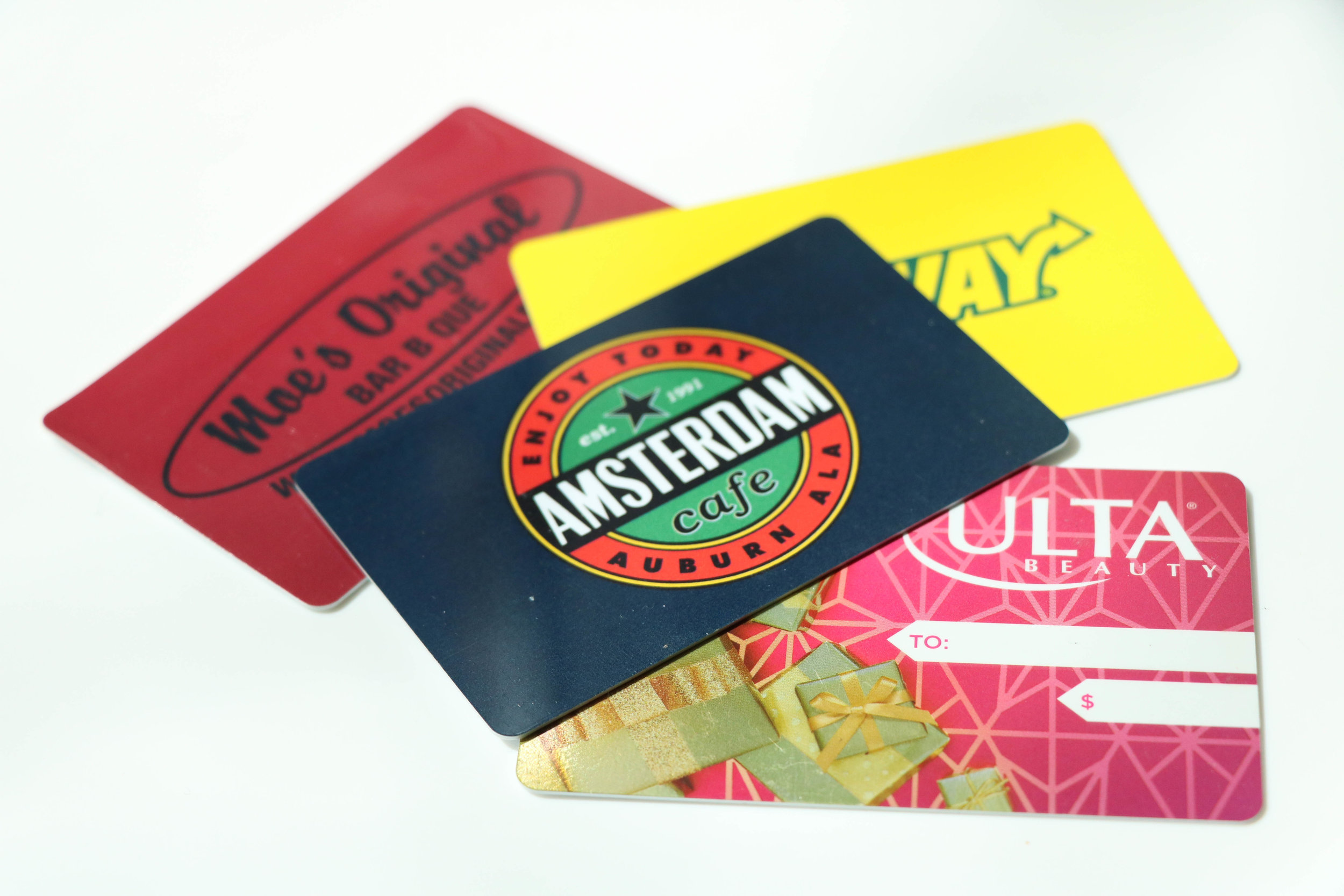  Everyone loves a great gift card. Pick their local food favorites like  Moe's Original BBQ &nbsp;or  Amsterdam Cafe  so you can tag along! 