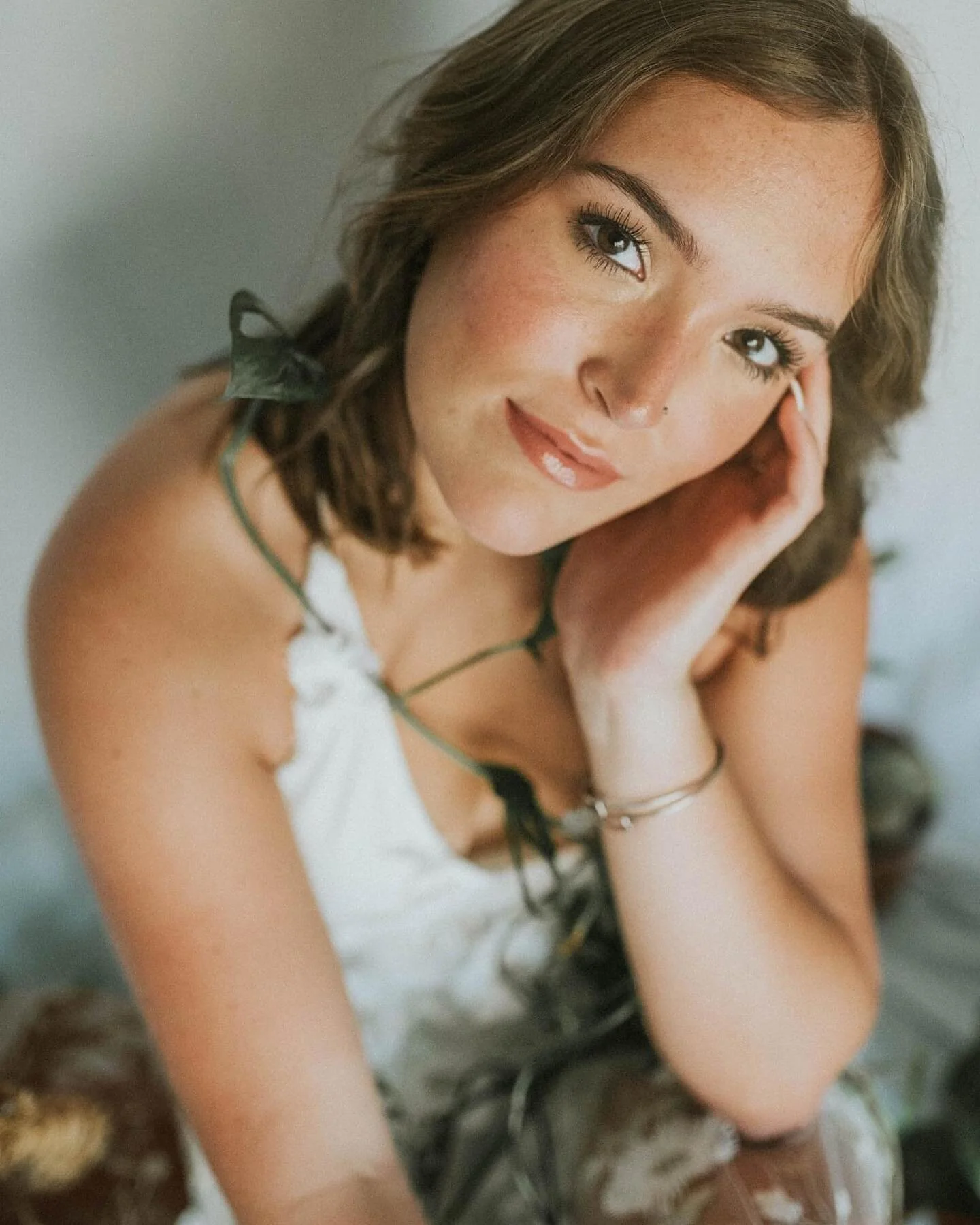I love being able to shoot indoors as much as outdoors! These were done inside my apartment, with a small backdrop setup, in front of sliding doors. all-natural light and cats trying to mess with us the whole time! It was fun! A senior shoot from a f