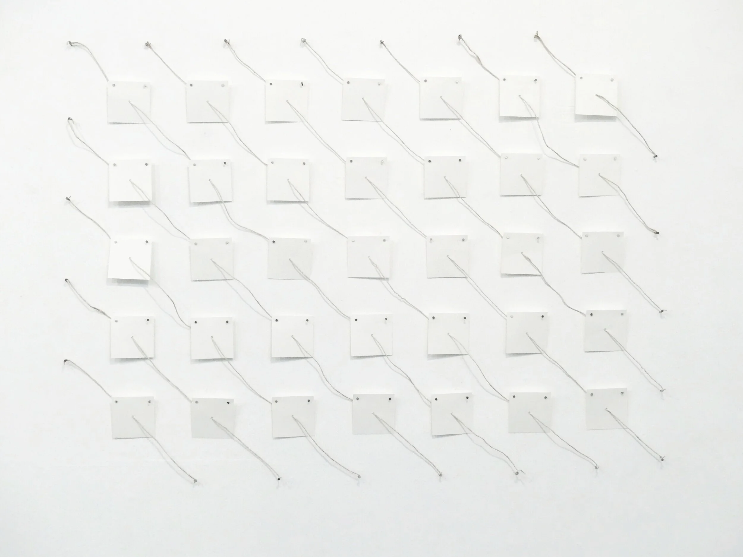 Diagonal Study I, Ally McKay, 2019. Paper, nail and clay coated jute, wall installation. AFTER