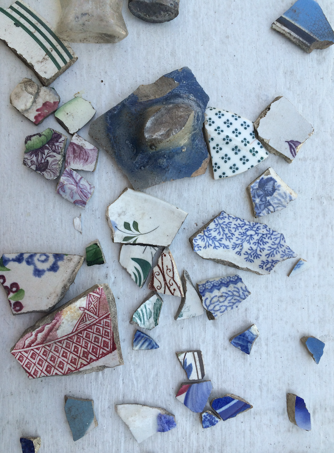 Shards of ceramics and pottery removed for inspection.