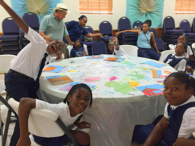 Eleutheran School children engaging in 'Paint Like Amos' workshop in parish hall. 
