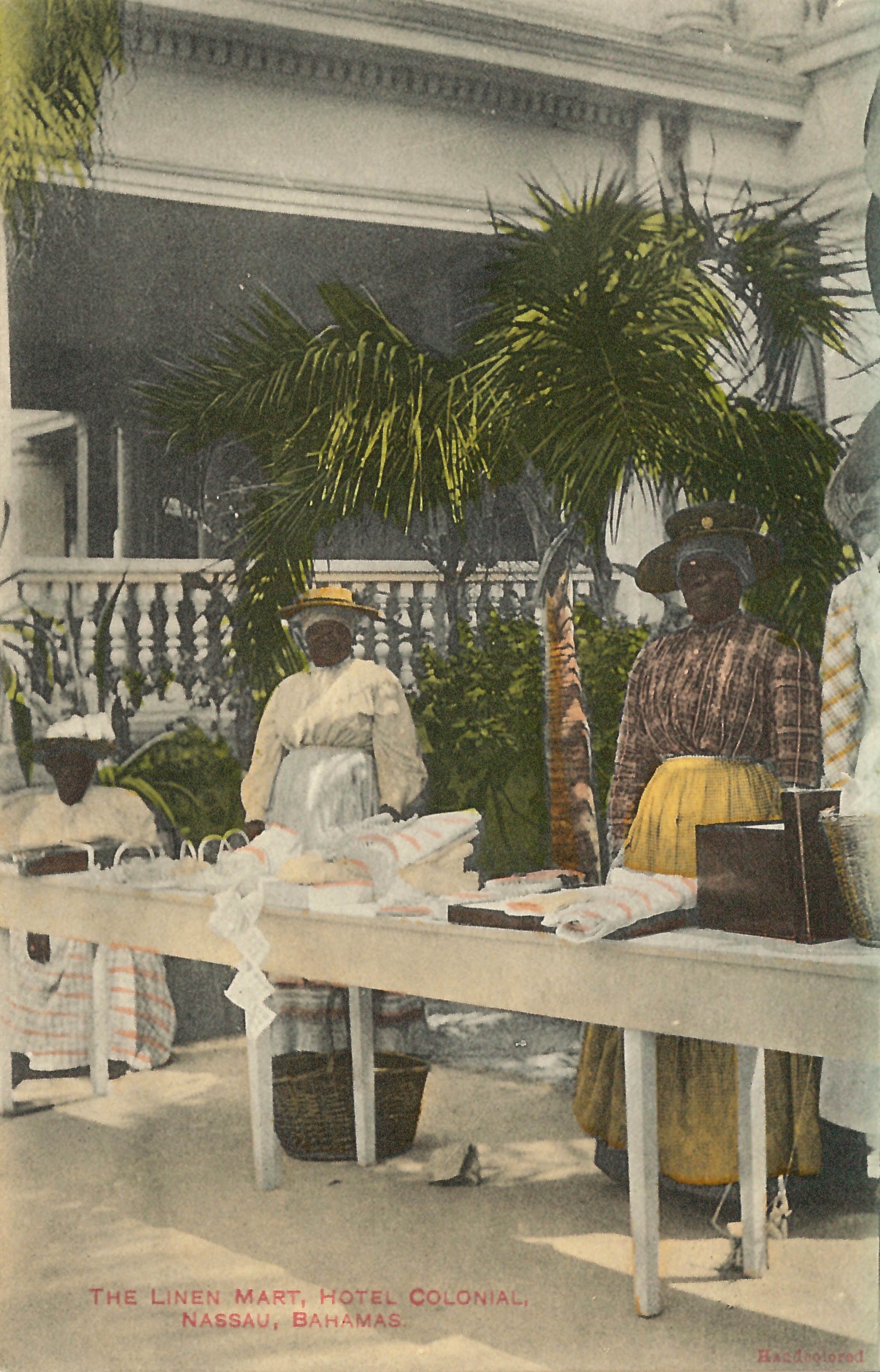  ‘The Linen Mart at Hotel Colonial’ (estimated c.1890-1930). Handcoloured colonial-era postcard by unknown artist. Image courtesy of the NAGB. Part of the National Collection. 