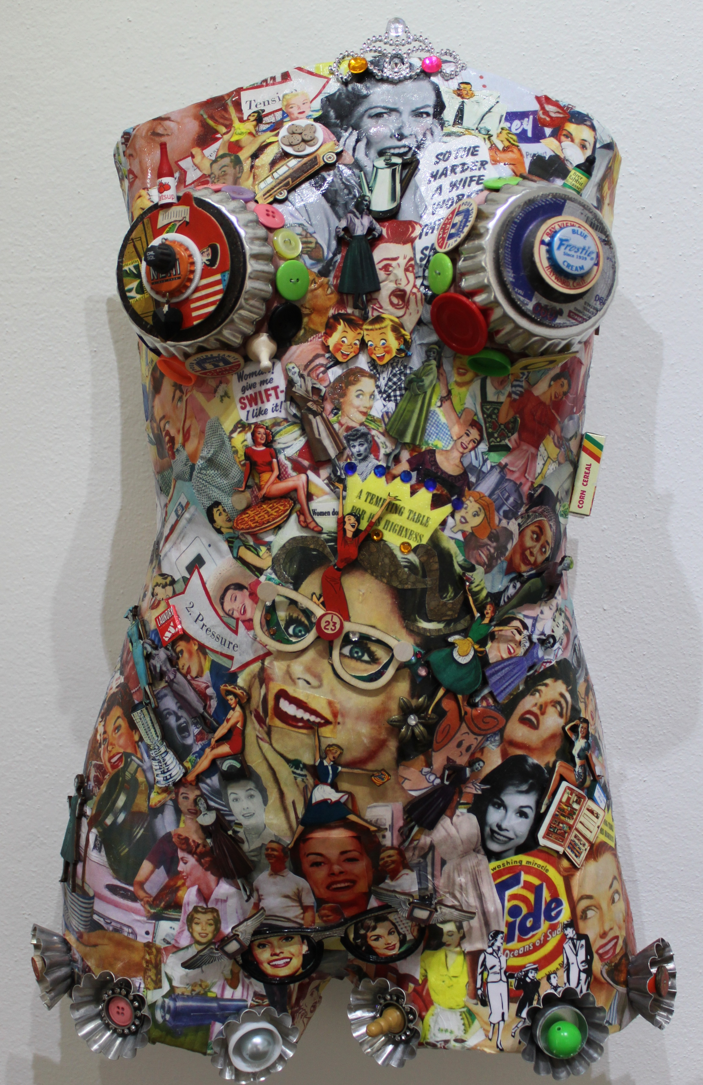 Sue Katz-Lightbourn, ‘A Woman’s Place Is In The...’ (2016), plaster form, vintage ads, found objects, 26 x 14”. 