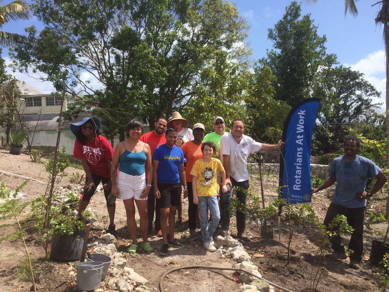 1. Rotarians posing for a group picture after a morning of hard work