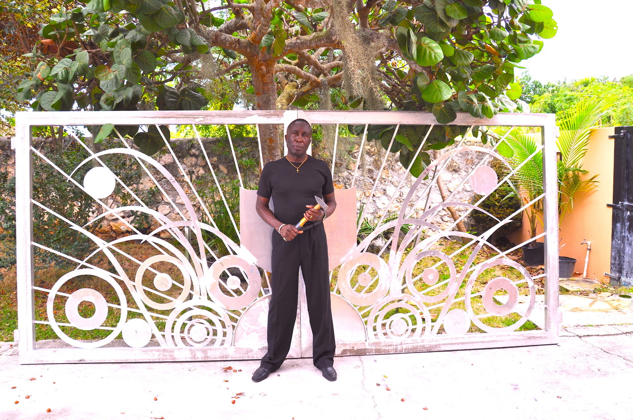  Portrait of Tyrone Ferguson in front of privately commissioned gates. Image courtesy the artist.
