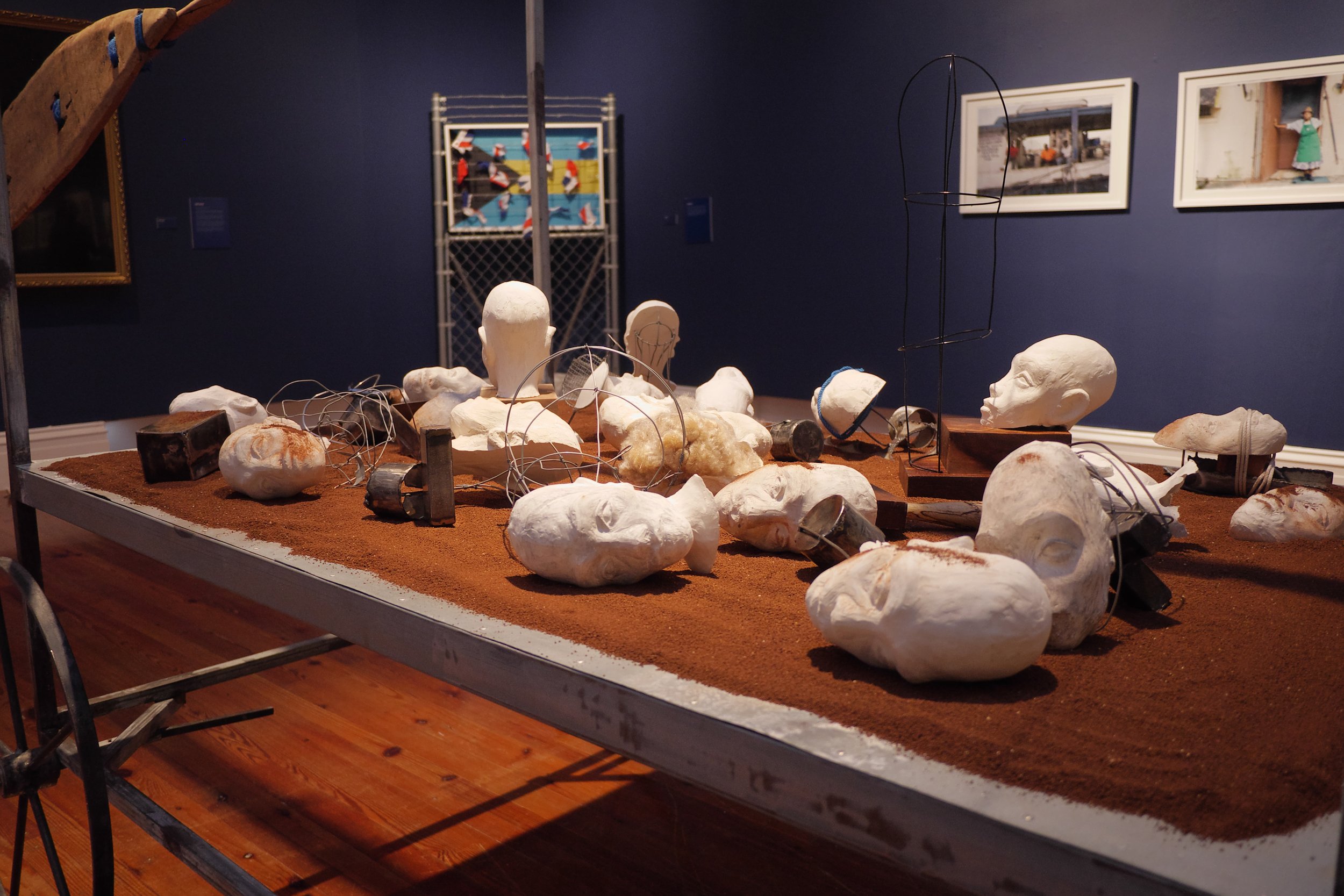 John Beadle. Detail shot casted heads in “Row Yah Boat”. Installation at the NAGB National Exhibition 8. Mixed Media. Variable Dimensions.