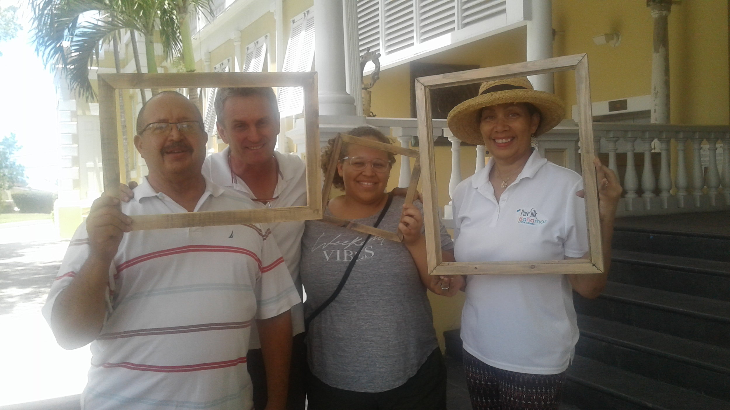 Artist Thierry Lamare and several participants proudly display their frames.