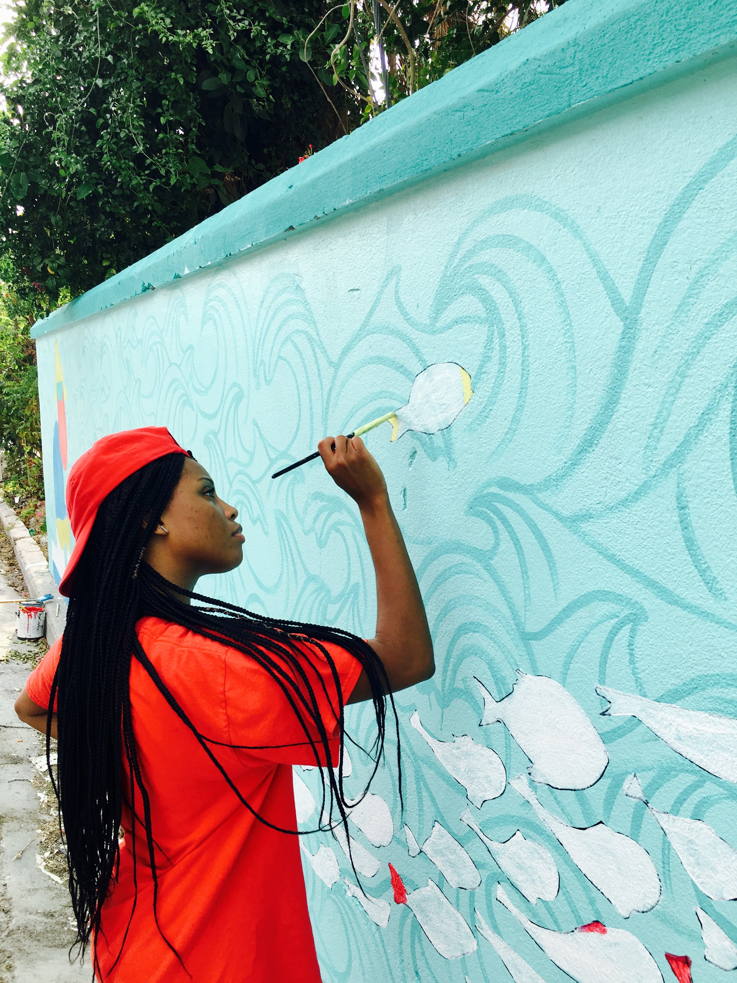 Shardae Pratt working alongside Dede Brown and Dylan Rapillard for the ‘World Oceans Day 2017’ mural on West Hill Street. 