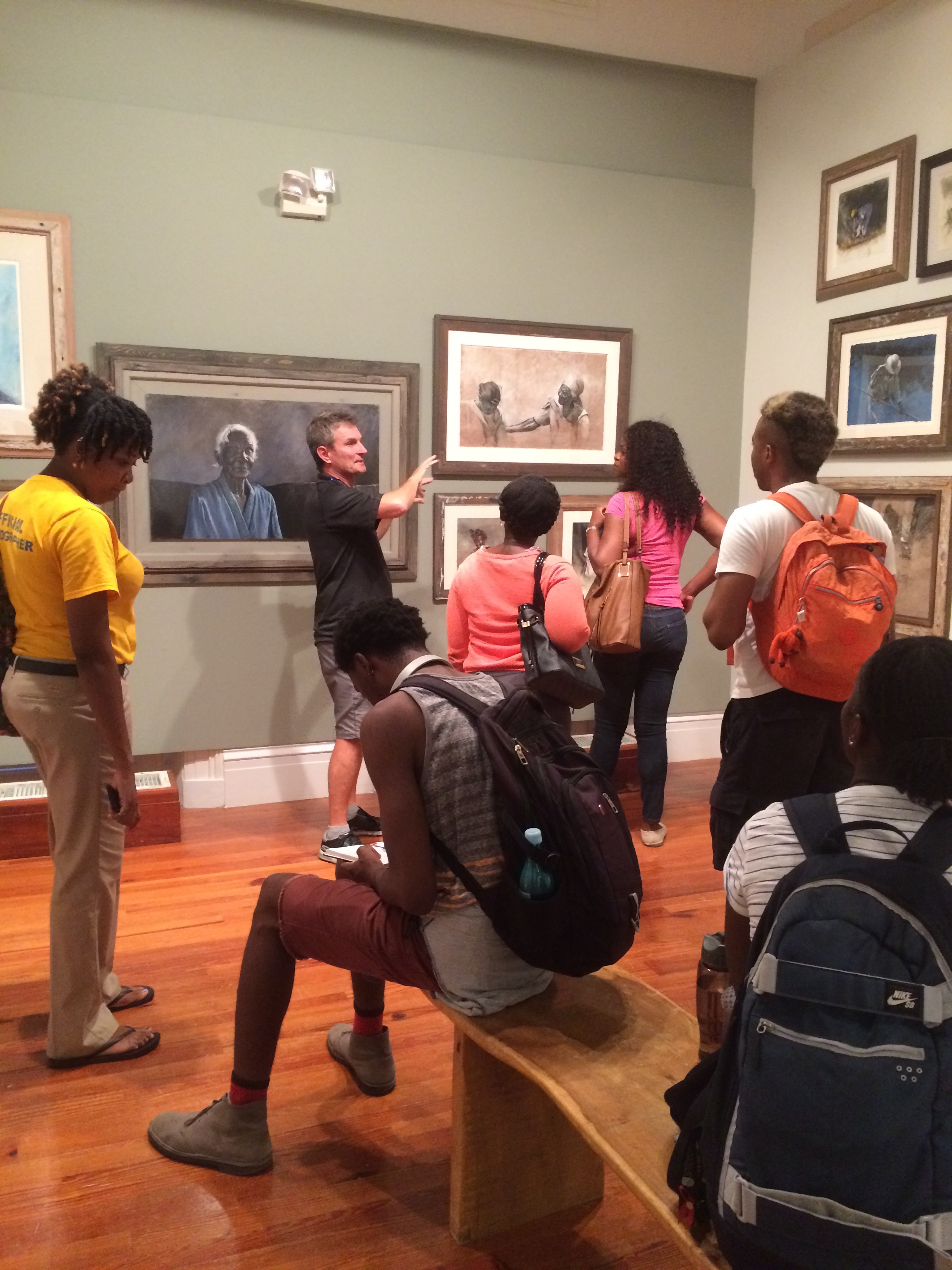 University of The Bahamas students visit Thierry Lamare’s “Love, Loss and Life” on view at the National Art Gallery of The Bahamas and receive a guided tour by the artist. Images courtesy of Dr. Ian Bethell-Bennett.