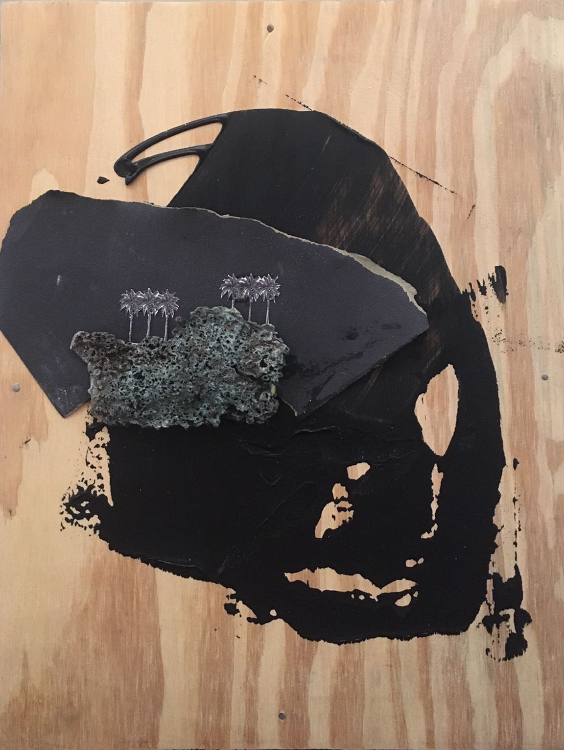“Black Paradise III” (2017), Jodi Minnis, found object and image with acrylic paint, 11” x 11”.
