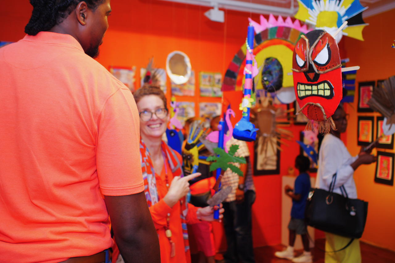 Parents, campers, volunteers and staff enjoying the exhibition opening