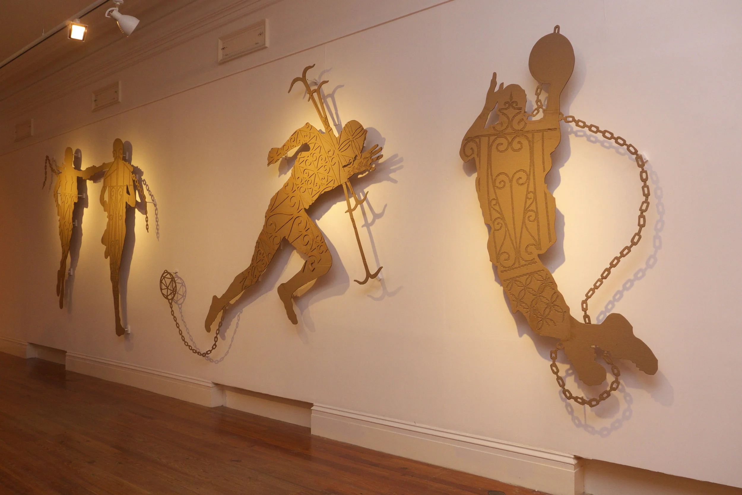 John Beadle’s “Higher Goals” (2014) shown as part of the 7th National Exhibition. His work for “We Suffer To Remain” further investigates and expands these cardboard figures of Bahamian and Caribbean society.