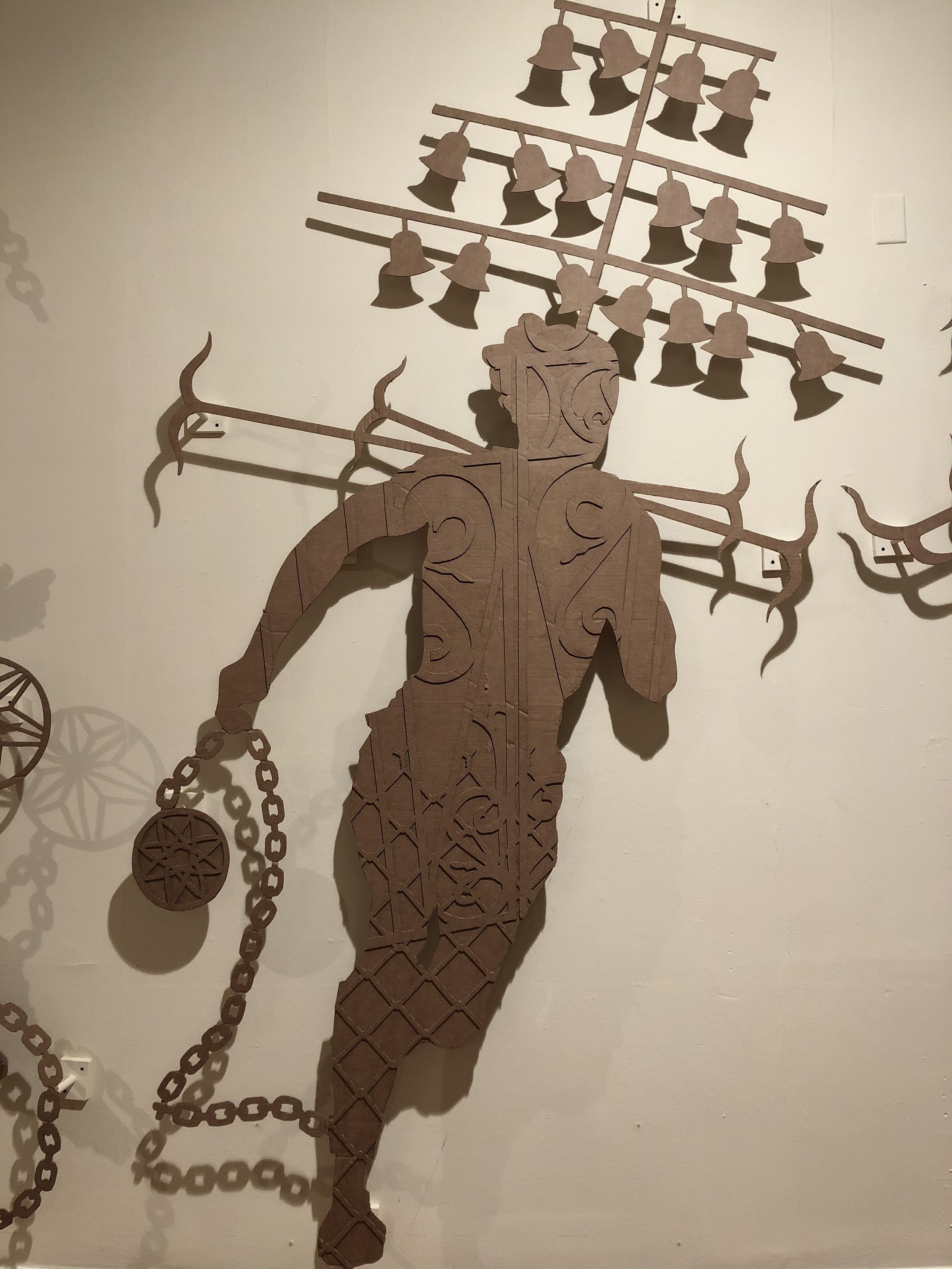 Detail of John Beadle's "Cuffed: held in check" (2018), a series of corrugated cardboard cutouts investigating representation and stereotyping around blackness as it relates to the legacies of the Atlantic slave trade.