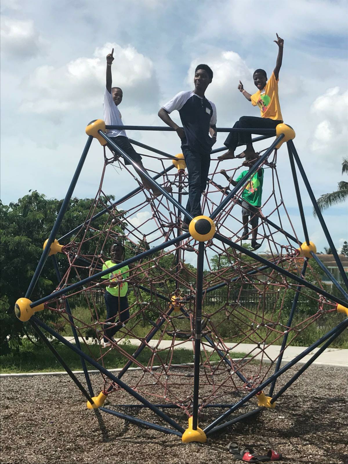 Students of Camp Lit: Big Pond gather for play time during lunch session on the jungle gym.
