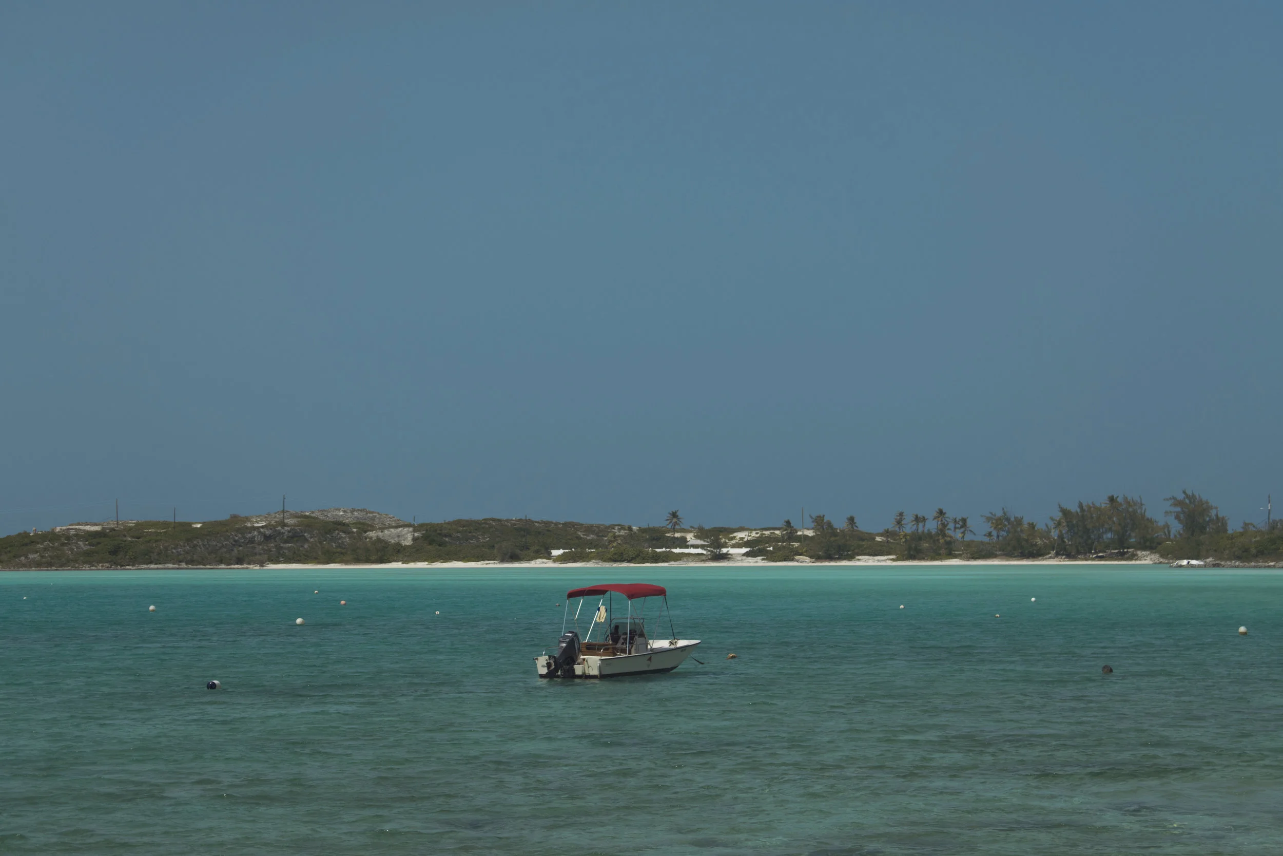 A lone fishing boat tied down off the coast of Exuma. Photo by Ethan Knowles.