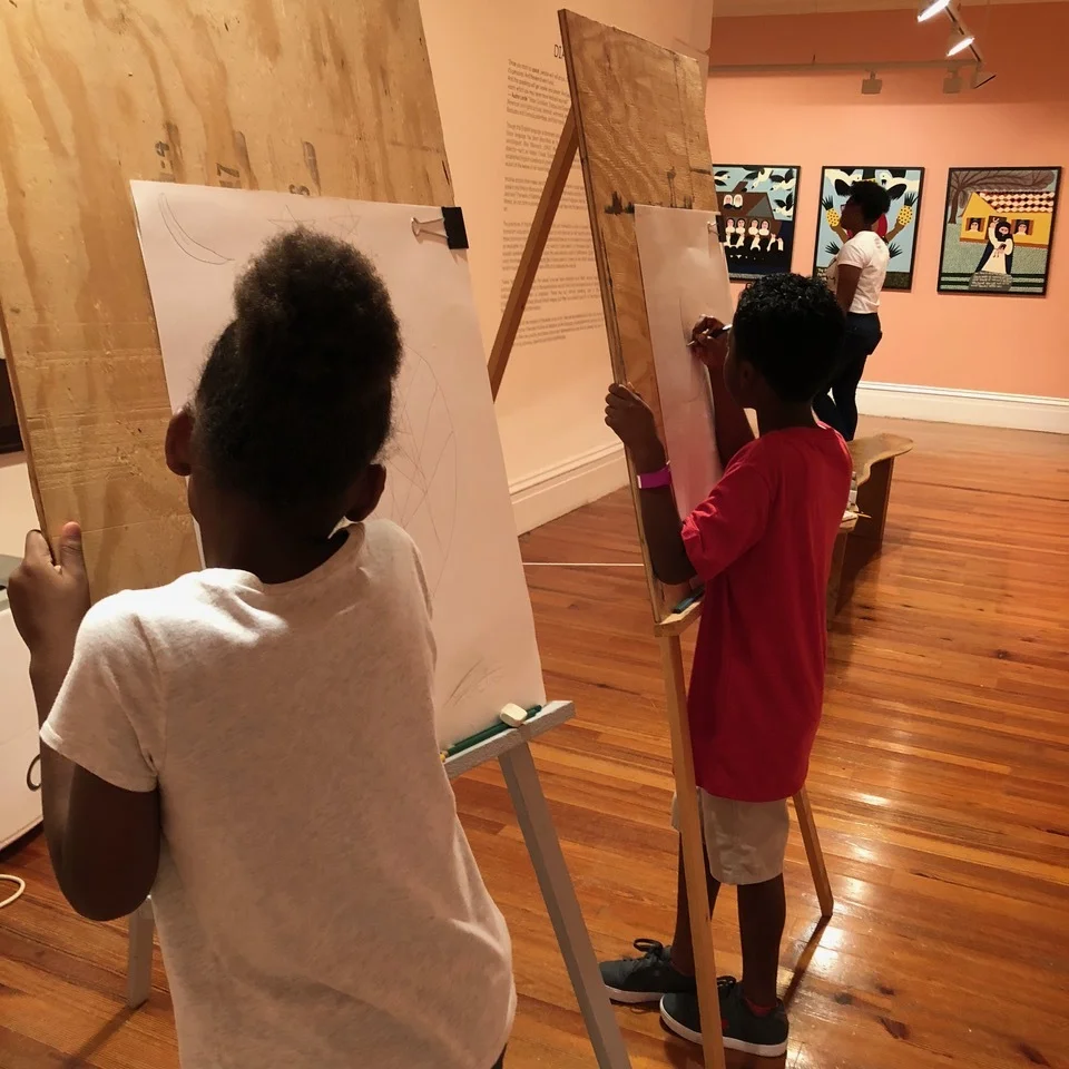 1. Two friends drawing in the galleries of our Permanent Exhibition.