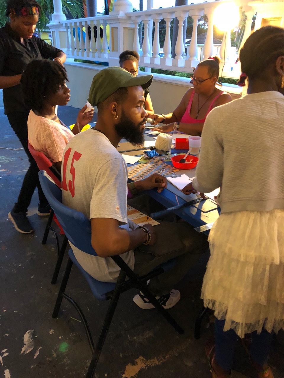 1. Event goers participating in the notebook making drop-in workshop 