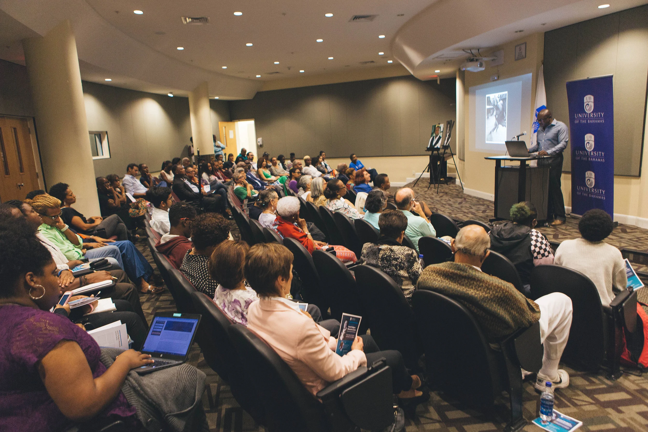 Dr. Kevin Browne makes his presentation, as photographed by Three Amigos Media.