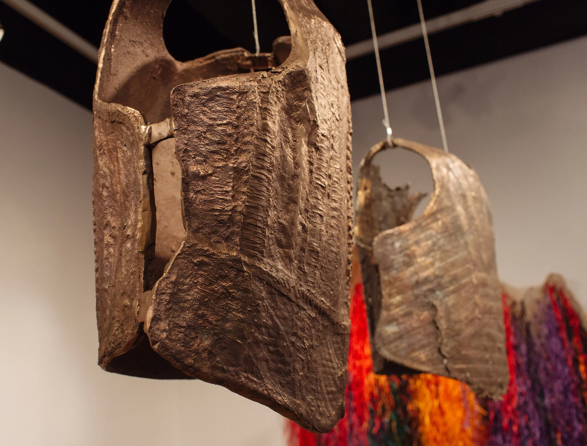 Elevating the Blue Light Special , (2018). Averia Wright. Mixed Media Installation. Bronze, Burlap, Raffia, & Various Textiles. Dimensions variable.
