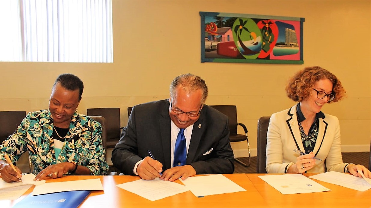 Shown signing the MOU and agreement are UB Provist Dr. Linda A. Davis, UB President Dr. Rodney D. Smith and NAGB Director MRs. Amanda Coulson.