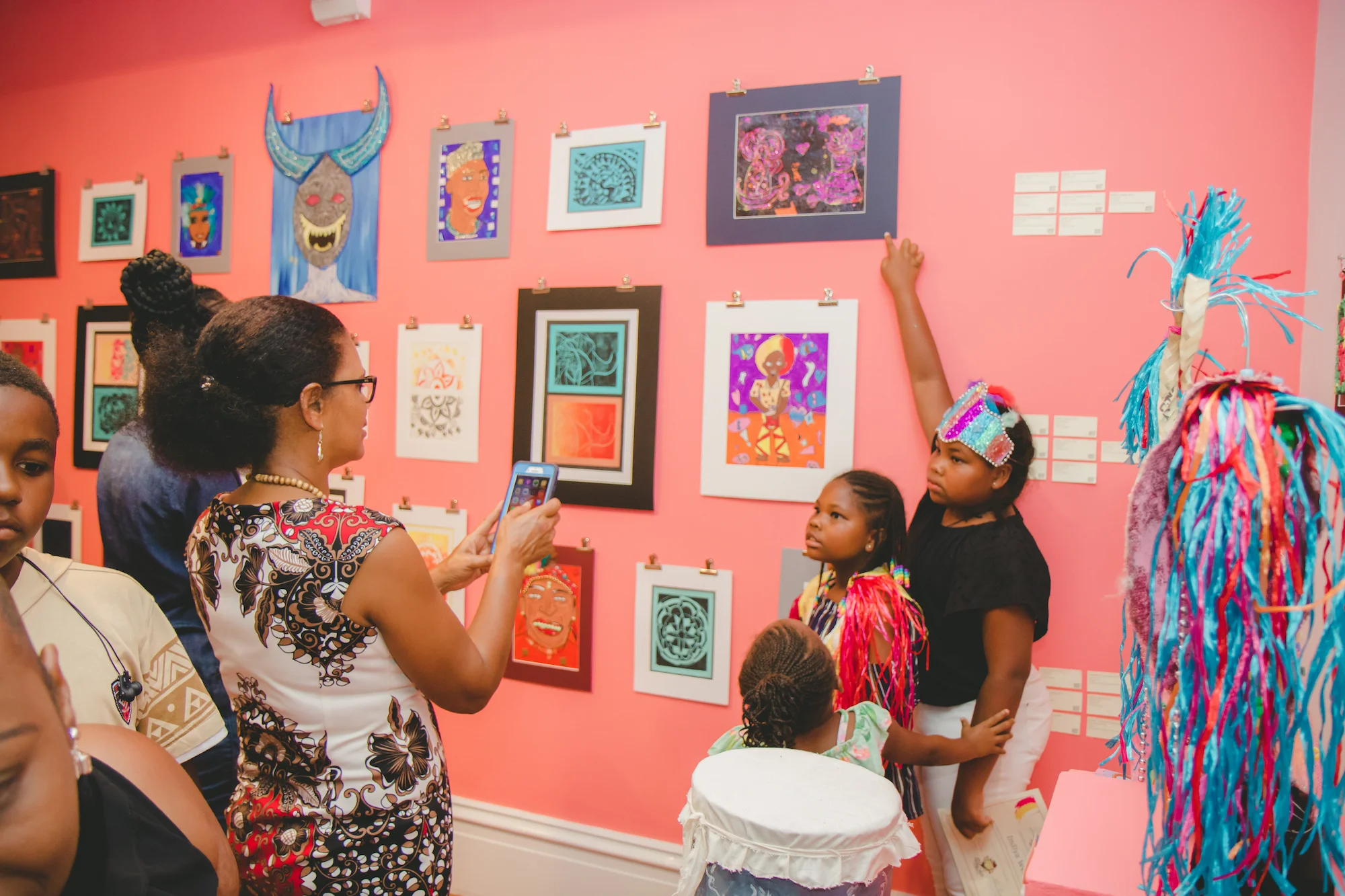 A camper proudly poses with her artwork.