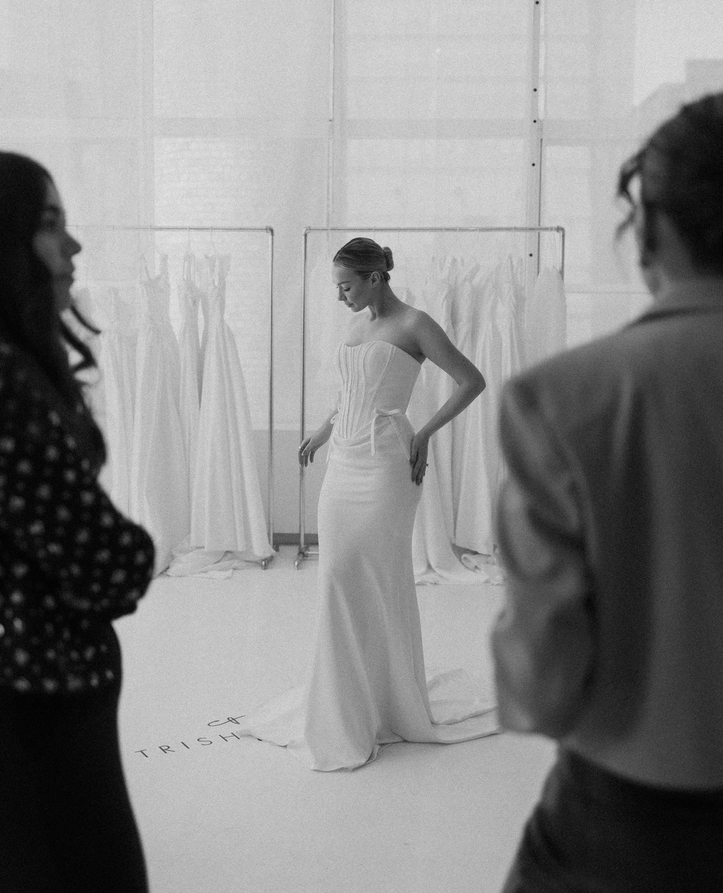 This is what it looks like between the moments. The chaos, the pinning, the last minute adjustments, the energy of a room full of people making something beautiful happen. Behind the scenes at New York Bridal Fashion Week felt like being let into a s