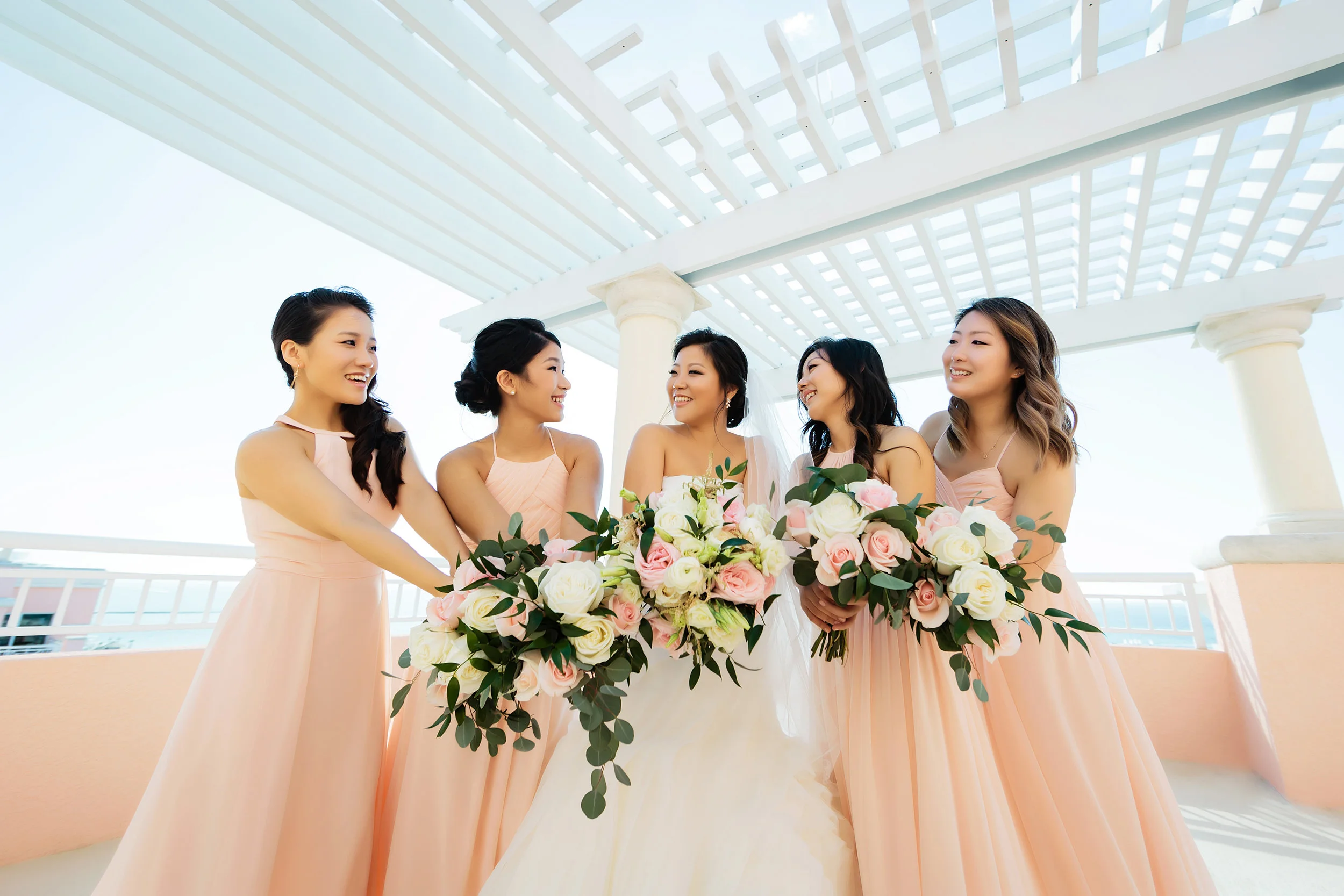 hyatt regency clearwater beach, bridesmaids, roses, peach, wedding photography, rooftop, beach, limelight photography
