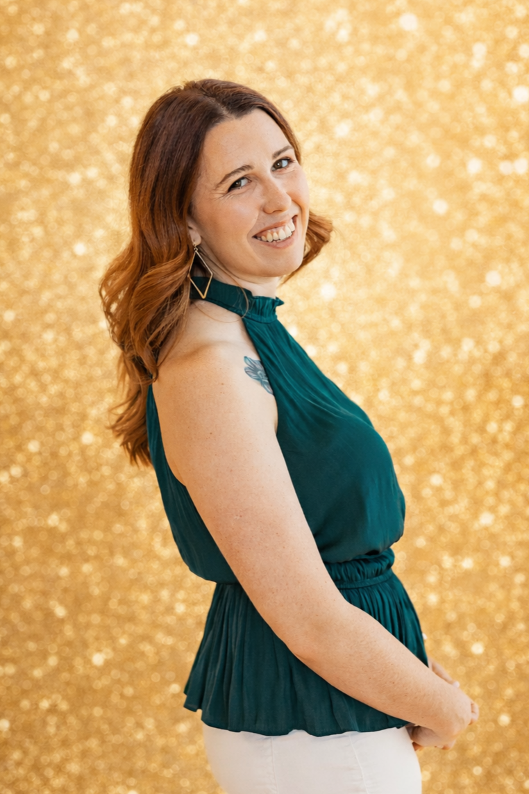 rylee littleson limelight photography's sales manager portrait, wearing a green halter top and smiling at the camera
