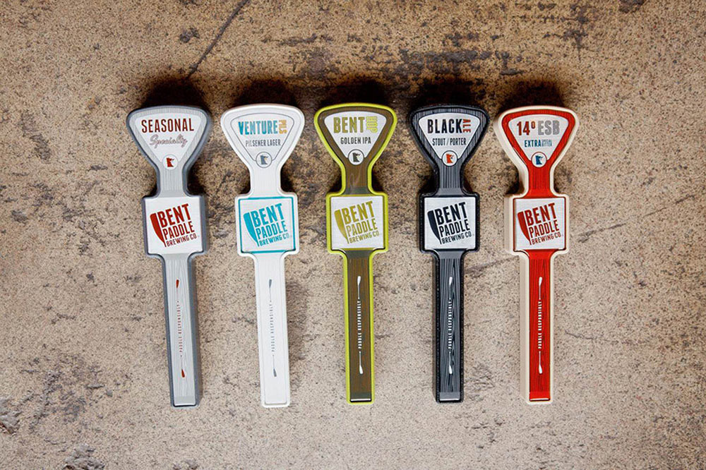 Tap handles, a side project that Greg and his crew worked on for Bent Paddle. Find out more of what they've got brewing in the beer world.