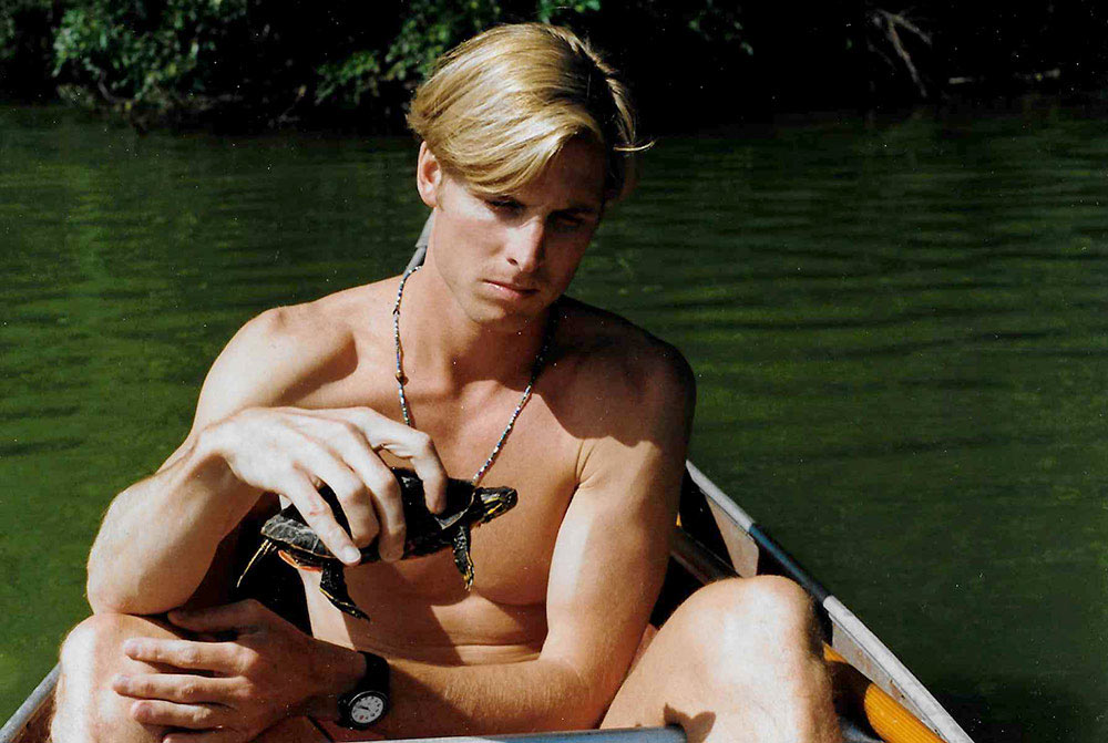 Greg enjoying the outdoors as a young Minnesotan, hanging out catching turtles and other sea life.