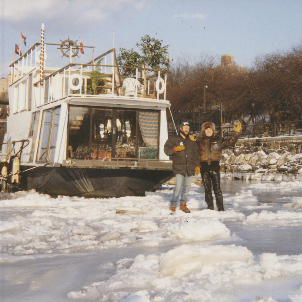 Jan & friend/colleague Doug Hynes standing on a frozen Hudson River, when it used to freeze solid. (1988)