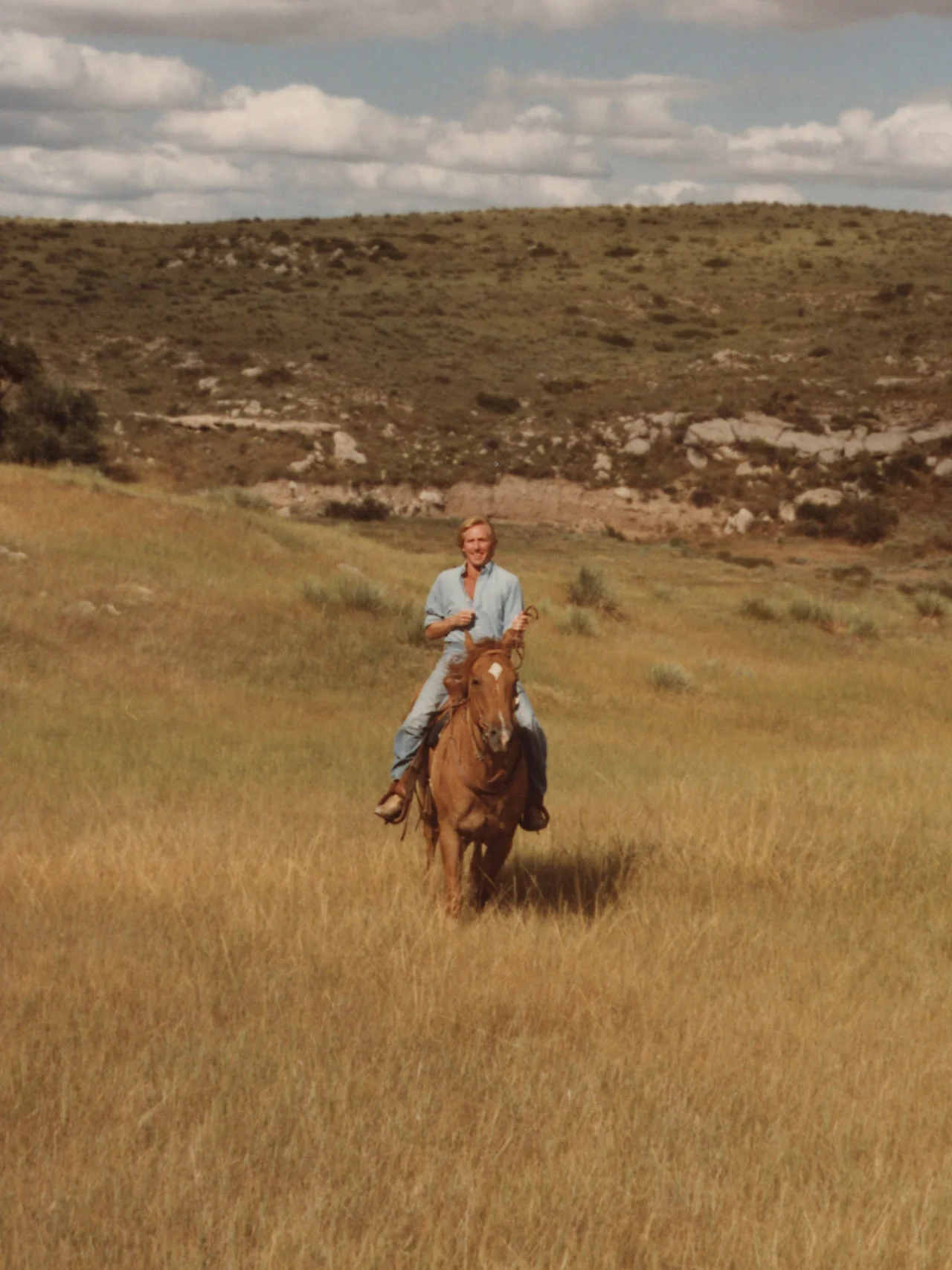 A young Jerry Helling riding a horse - growing up on a ranch in Colorado