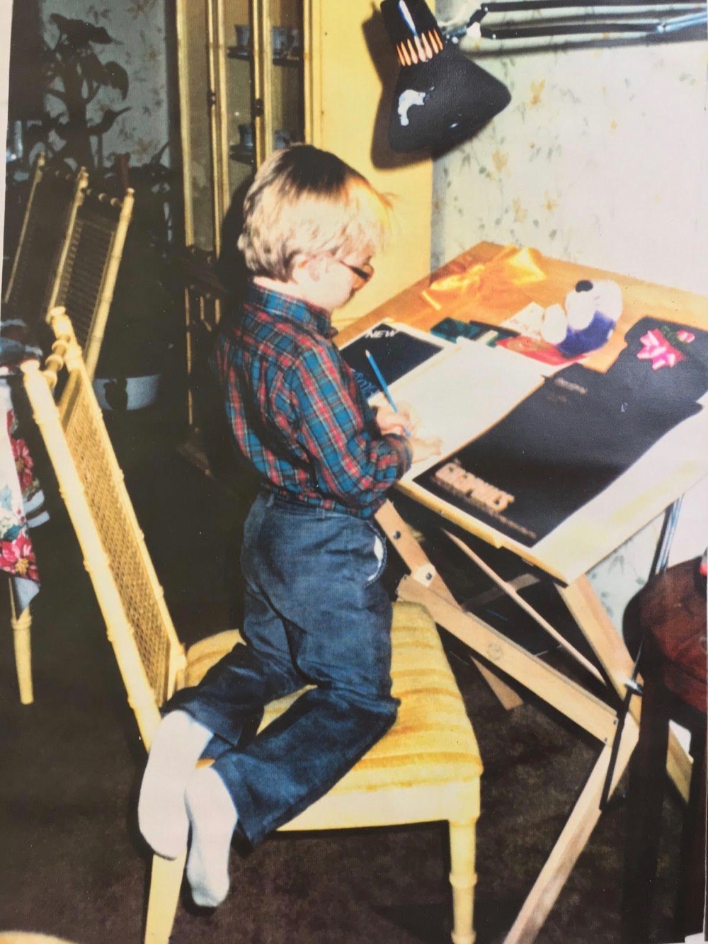 Chris at his first drafting table, courtesy of Uncle Rocky. Age 4 or 5.