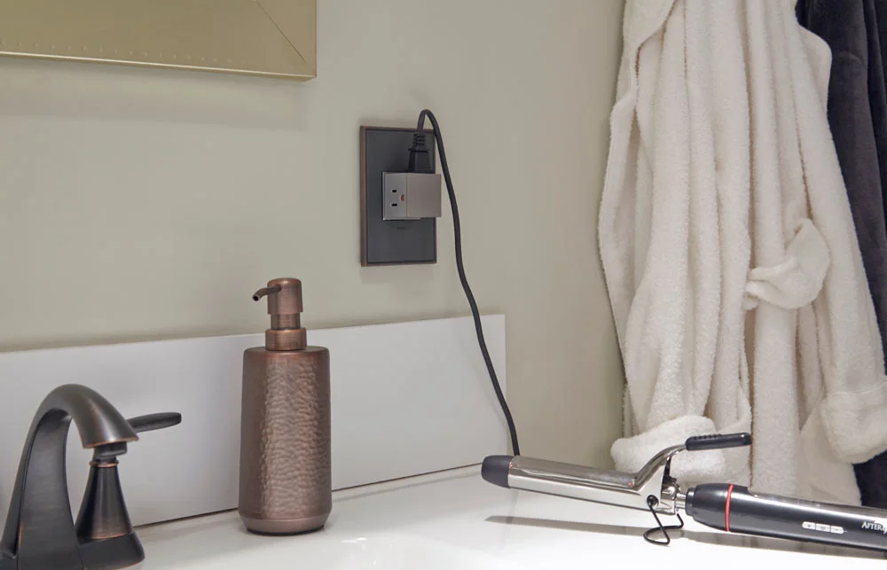 The Pop-Out Outlet provides three (THREE!) outlets when needed, but remains flush with the wall when not in use.