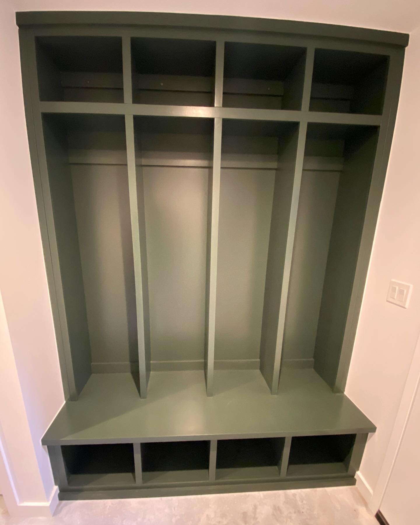 This one was at a tough angle to capture, but you get the gist... 
Custom designed built-in mud room coat rack / storage nook, perfect for this small space between the garage and basement playroom. Finished beautifully with Foxhall Green paint from @