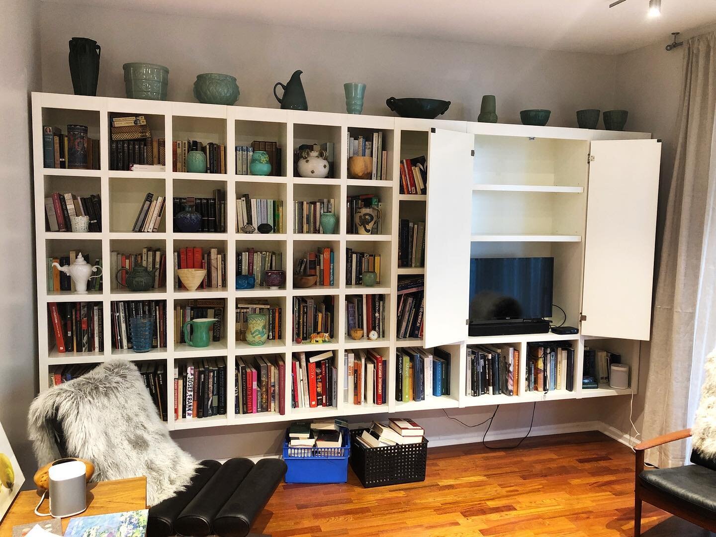 When you&rsquo;ve got cool stuff, you&rsquo;ve got to show it off. 

We&rsquo;re big fans of this floating bookcase with a hidden entertainment center that we created for this South Loop condo. It takes up minimal space but adds oh-so-much storage an