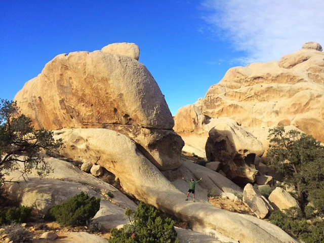 Mike playing in the rocks after coming down from Ryan Mountain