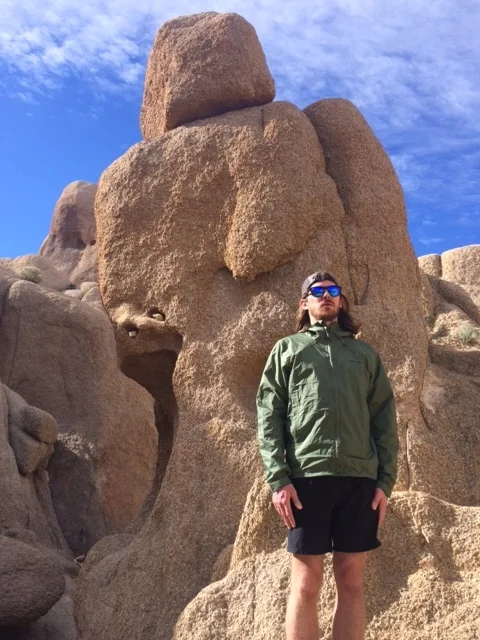 Do you see the man made out of rocks behind Mike?
