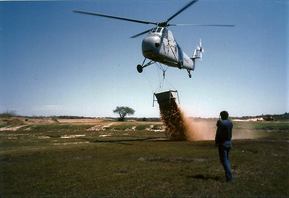 Helicopter Dumps Sand on Bog | The goal was to evenly cover the bogs with an 1.25" of sand; it took two years to sand the 14 acre.