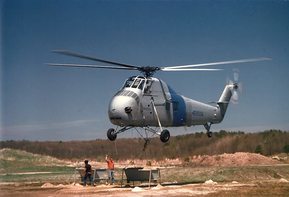 Helicopter Gets Load of Sand | The 14 and 35 acre bogs were in need of a lot of sand; the river kept the ice open, so Tidmarsh resorted to flying sand on with helicopters.