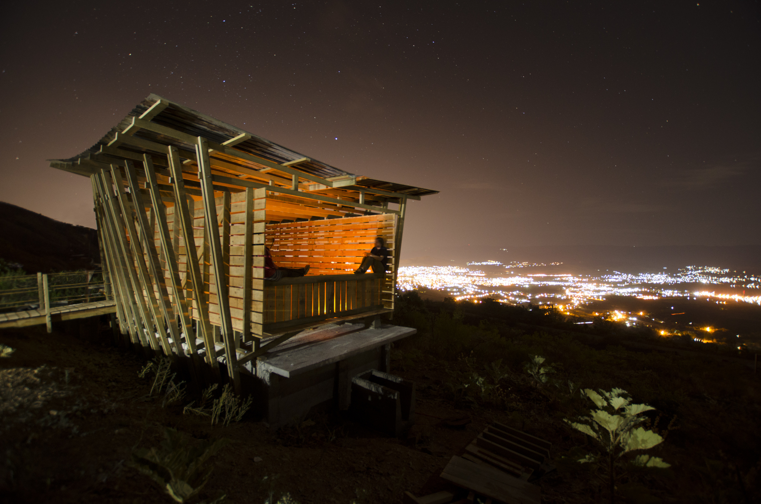 LA MESITA In architecture schools, students seldom move beyond schematic design and rarely see construction as a design exercise, missing out on a range of creative opportunities that occur after schematics are solidified. Teaming with 27 volunteers and 34 students from 5 countries enrolled in 24 different design programs, we designed and built 5 projects in 5 consecutive spring breaks to help fill this void. Four years before shovels hit the earth, we formed an alliance with: San Pablo Etla, a village on the outskirts of Oaxaca, Mexico, and A dozen passionate expats excited by the idea and willing to provide local support, La Mesita, an eco-reclamation site on degraded land in San Pablo Etla A Oaxaca-based foundation that supplied funding for building materials. Work begins in summer - in Minnesota and Oaxaca - to identify next year’s project. Two clients - San Pablo Etla and the architecture students - burden us to identify a project that meets specific programmatic needs at La Mesita, while offering an engaging design/build experience for students. We must also plan around the understanding we have only a week to deliver a completed project, as an unfinished build is just a liability for the community. We spend fall and winter developing schematics with San Pablo Etla to ensure approvals are secure before the end of winter, so materials are on the ground the first day of spring break. Planes land, we meet the group, try to sleep, (optional) yoga at dawn on the hostel roof, attend a traditional desayuno prepared by the village, and shovels flying by 10. Atop the hill after breakfast, students see the approved schematics for the first time. One or two hands inevitably raise as many shoulders slump. “What, design is done? You mean we’re just building this?” At the closing day fiesta, after the last nut is wrenched tight, those same students will be heard over the music in broken Spanish, “no, no, we designed it together!” They realize, maybe for the first time, that design is not just an initial idea, but a process of rigor, innovation and refinement covering the duration of a project.