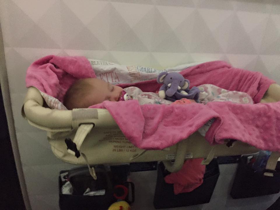 Our daughter in the Bassinet on our long international flight