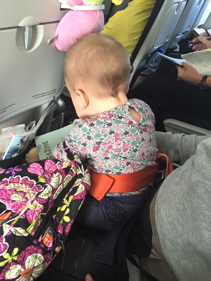 This was on our Air France flight from naples to paris -- yes, she had an additional seatbelt.